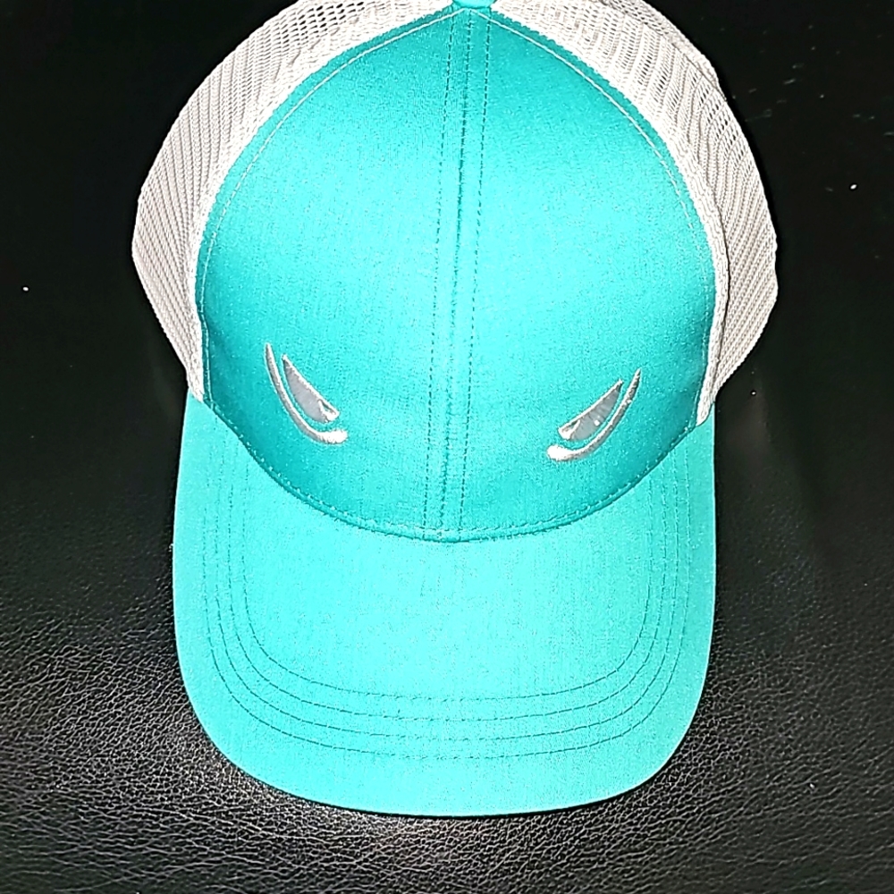 Hat by Mad Pelican fishing gear.